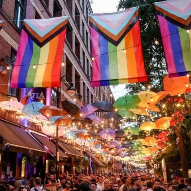 Manchester street scene with colourful inclusive flags