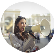 young person with loudspeaker smiling